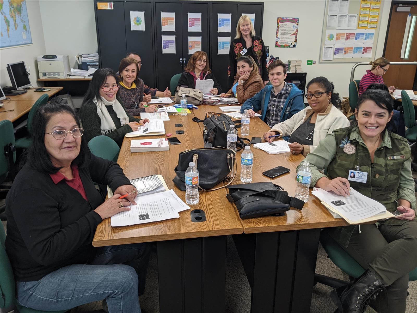 ESOL students sitting at the class table 