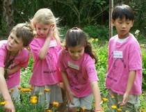 students in field of flowers 