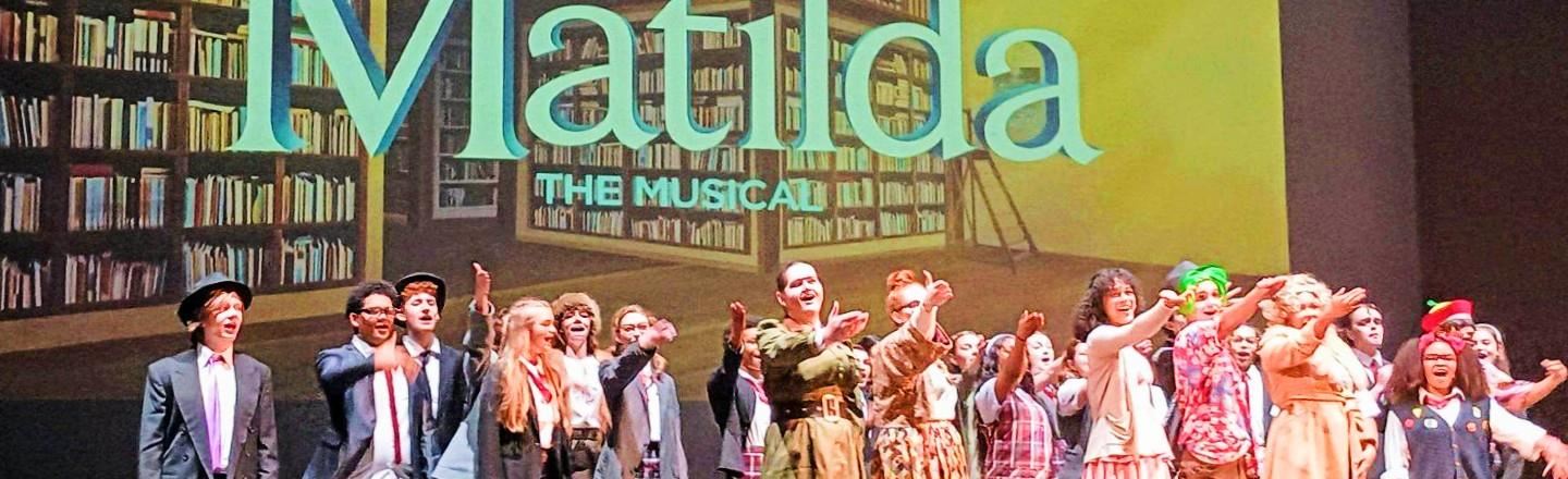 Students performing in Matilda